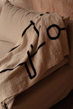 Jeté de lit en coton noir naturel motif œil protecteur et franges