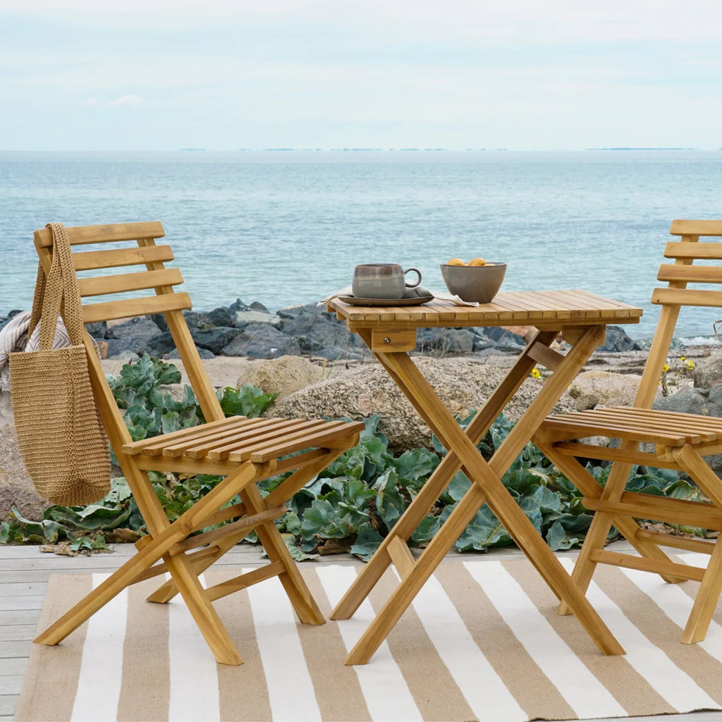 Table pliante en teck naturel avec chaises bistrot