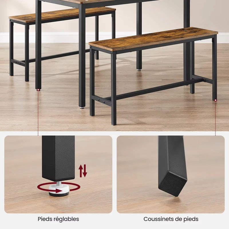 Zoom sur les pieds réglables et les coussinets de la table en bois.

