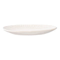 Assiette ovale en céramique blanche striée, finition brillante texturée au bord