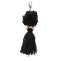 Porte-clés pompon noir en coton avec fermoir argenté et coquillages cauris