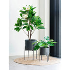 Arbre artificiel magnolia haut en pot cylindrique noir mat sur pieds métal fins