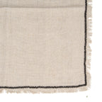 Serviette de table en lin naturel beige texturé avec bordure noire contrastante
