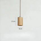 Suspension bois moderne modèle 1 avec abat-jour en bois naturel et lumière LED tamisée.