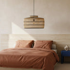 Suspension en rotin ajouré naturel et noir, forme tambour Ø61 cm