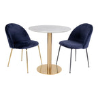 Chaises velours bleu marine pieds métal doré et noir près table ronde marbre blanc Ø70 cm