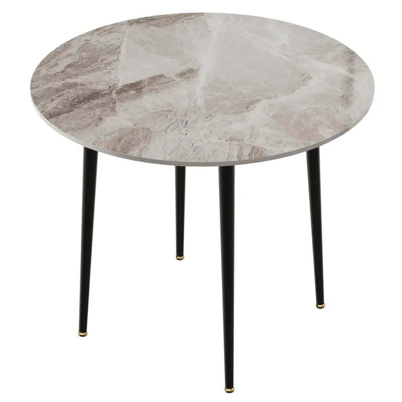 Table à manger ronde avec un plateau effet marbre gris et pieds en métal noir.
